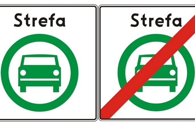 Jest znak drogowy strefy czystego transportu. Zielone auto